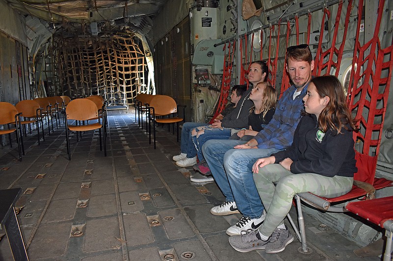 Maverick House, Kassi House, Nora Isgrig, David Isgrig and Natalie Isgrig sit inside a Lockheed C-130 Hercules military transport airplane. They were attending a past Military History Appreciation Weekend at the Museum of Missouri Military History in Jefferson City. (News Tribune file photo)