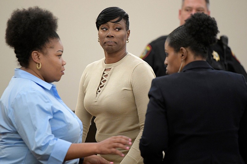 Crystal Mason, center, convicted of illegal voting and sentenced to five years in prison, at the Tim Curry Justice Center in Fort Worth, Texas, on May 25, 2018. (Max Faulkner/Fort Worth Star-Telegram/TNS)
