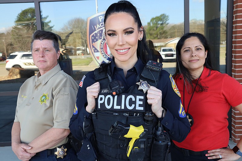 Capt. Kimberly Lett (from left), Officer Heather Rappold and Lt. Cassie Blackerby say the satisfactions of community service help offset the stress and social difficulties of working in law enforcement.  Women make up almost one-third of the Jacksonville Police Department patrol force and almost half the Criminal Investigations Department. (Special to the Democrat-Gazette/Dwain Hebda)