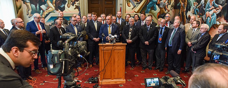 Julie Smith/News Tribune
Lt. Gov. Mike Kehe, at podium, is flanked by legislators who supported HB 2005, an eminent domain reform bill that recently passed through the legislature. The bill, praised for strengthening individual property rights, is awaiting action from the governor to become law.