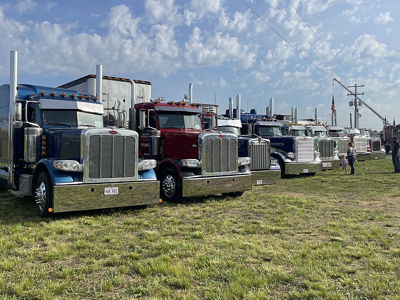 Trucks line up together for the Crossroad Shopping Plaza second truck meet on Saturday, May 14, 2022. Visitors come to the event for games, activities and awards. (Democrat photo/Kaden Quinn)
