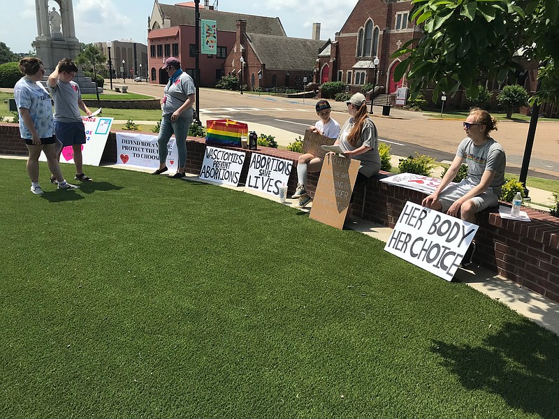 Members of Pro Choice TXK rally Sunday, May 15, 2022, near the federal building in downtown Texarkana. The group mobilized over recent news signaling a potential overturning of the U.S. Supreme Court's landmark 1973 Roe v. Wade decision. (Staff Photo By Greg Bischof)