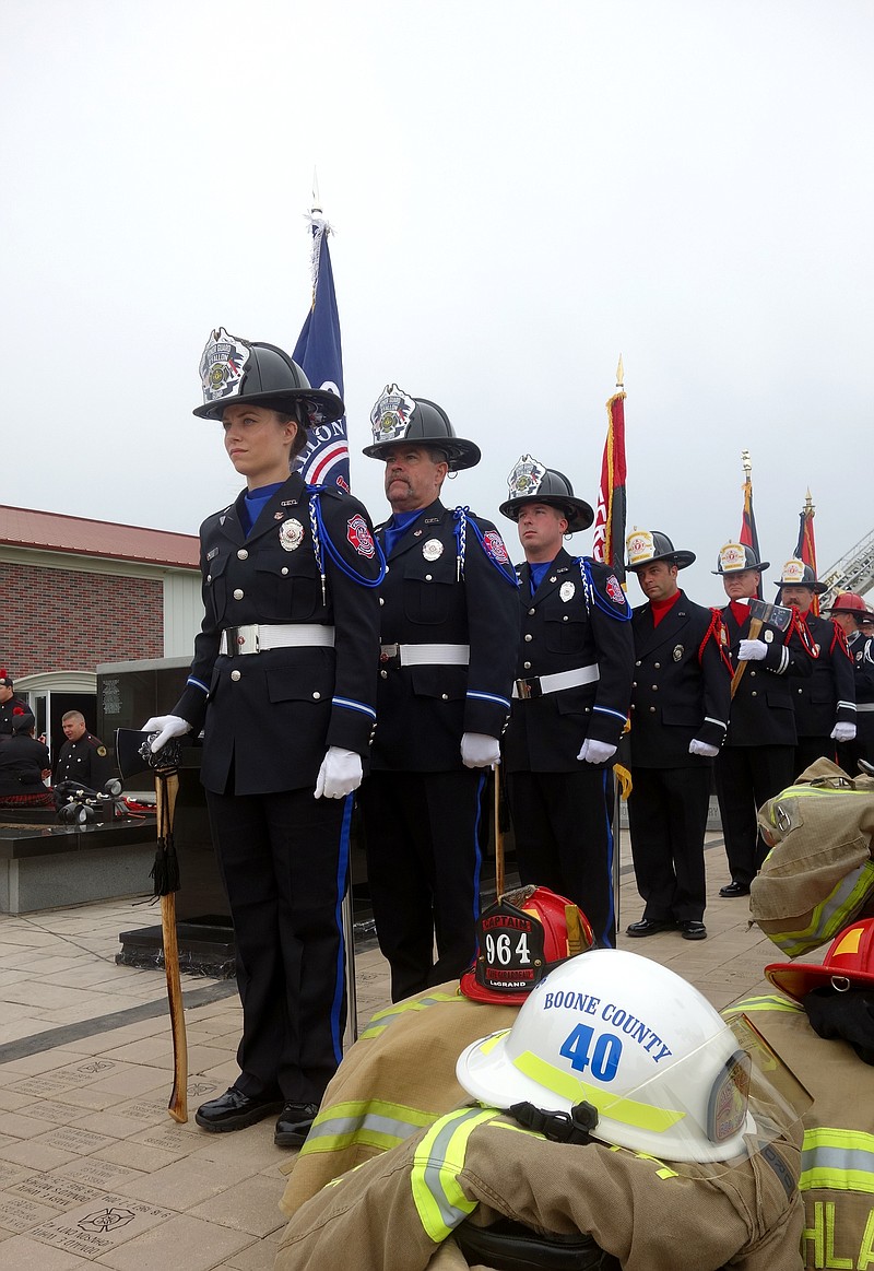 Fire service members line up during a memorial for fallen firefighters on Sunday, May 15, 2022, held at the Fire Fighters Memorial in Kingdom City, Mo. (FULTON SUN/MICHAEL SHINE PHOTO)