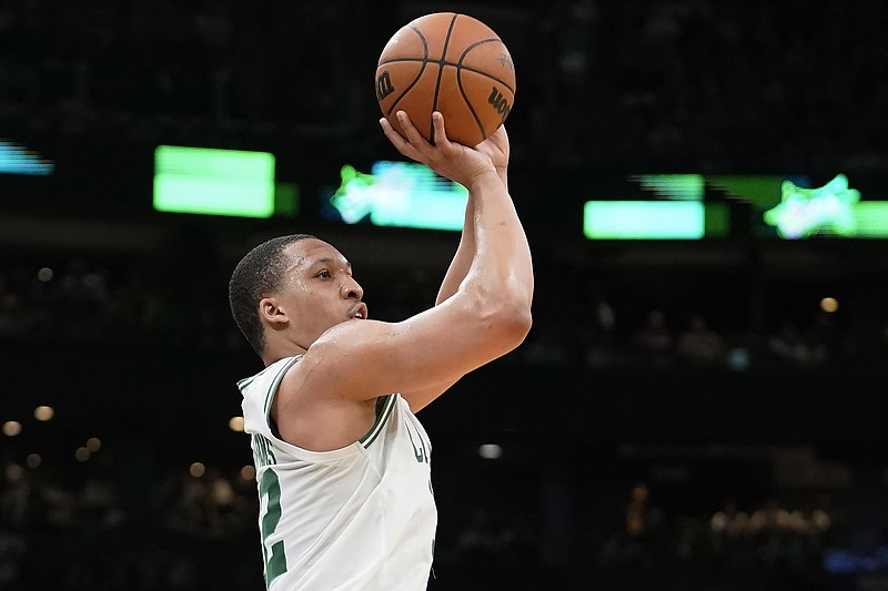 Boston Celtics forward Grant Williams shoots at the basket during the second half of Game 7 of an NBA basketball Eastern Conference semifinals playoff series against the Milwaukee Bucks, Sunday, May 15, 2022, in Boston. (AP Photo/Steven Senne)