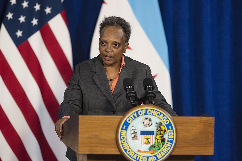 FILE - Mayor Lori Lightfoot speaks during a news conference at City Hall, Monday, May 9, 2022, in Chicago. A curfew banning unaccompanied minors will be implemented to combat violence after a 16-year-old boy was fatally shot near “The Bean” sculpture in downtown Chicago's Millennium Park, which is among the city’s most popular tourist attractions, city officials said Sunday, May 15, 2022. “This senseless loss of life is utterly unacceptable,” Lightfoot said in a statement. (Anthony Vazquez/Chicago Sun-Times via AP, File)