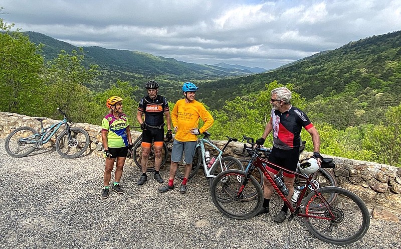 Dalene Ketcher (from left), Dan Giesse, Tom Hanna and David Hedges take in the scenery during a four-day gravel-grinding bike trip April 28-May 1 on the part of the Arkansas High Country Route that crosses the Ouachitas. (Special to the Democrat-Gazette/Bob Robinson)
