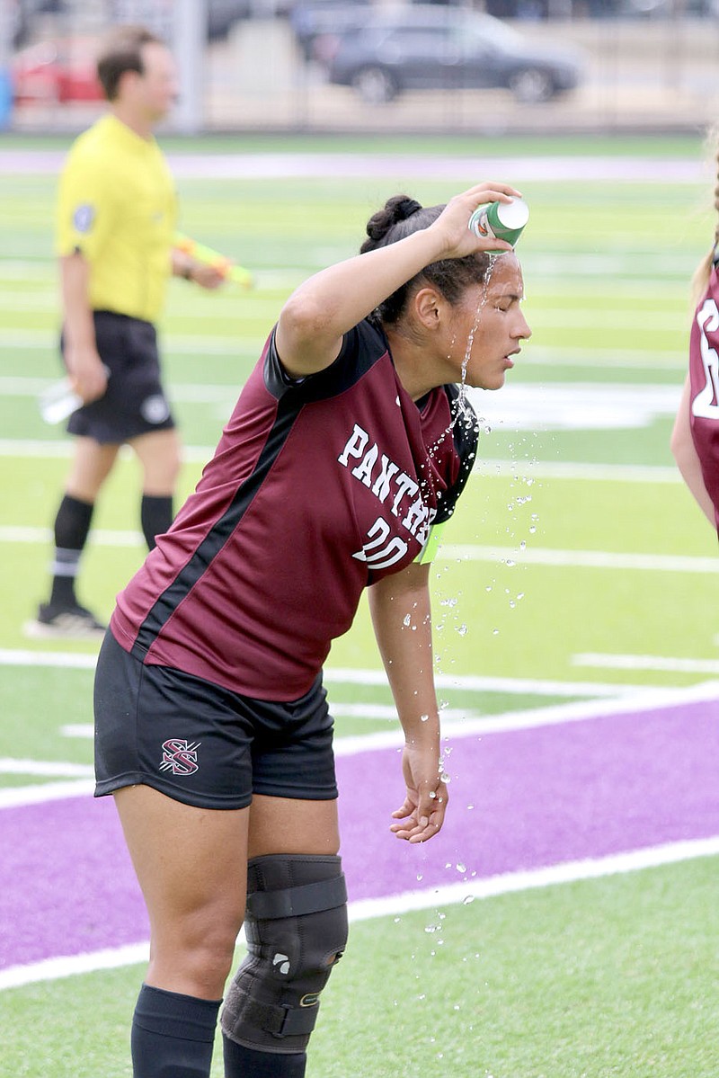 Mark Ross/Special to Herald-Leader
Siloam Springs senior forward Halle Hernandez pours cold water over her head to stay cool during the state semifinals against Little Rock Christian on Saturday. Hernandez has been one of the Lady Panthers' top players in 2022 after missing most of the 2021 season with a torn ACL. Hernandez and the Lady Panthers play Searcy at noon Friday in the Class 5A state finals in Benton.