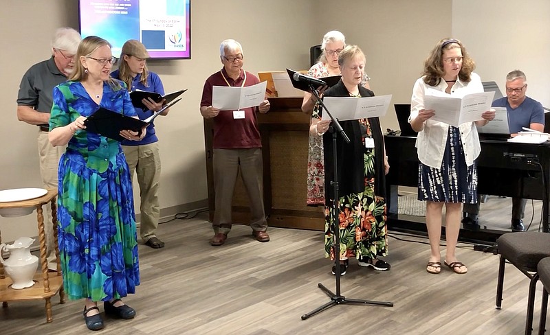 Members of the Oasis Church of Christ choir practice singing "A Ukrainian Prayer" before church Sunday, May 15, 2022. (Joe Gamm/News Tribune photo)