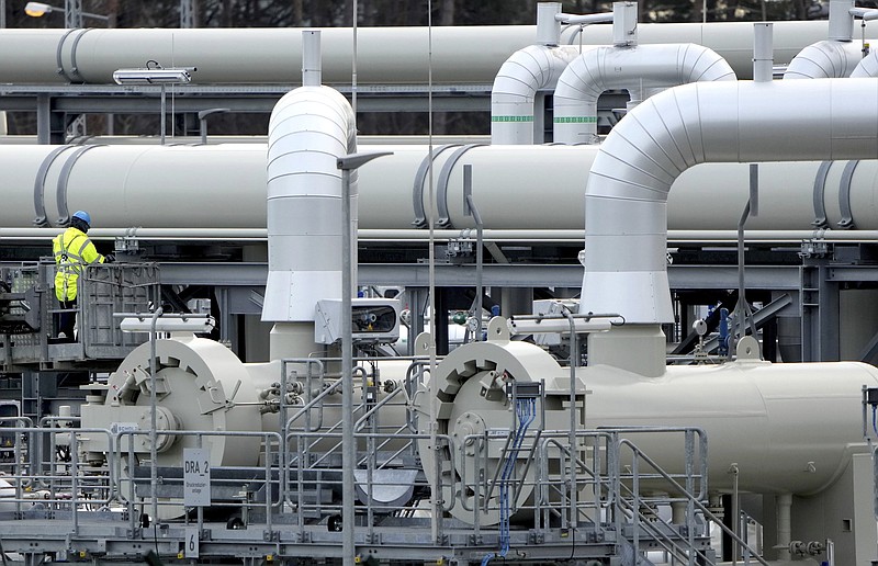 FILE - Pipes at the landfall facilities of the 'Nord Stream 2' gas pipline are pictured in Lubmin, northern Germany, on Feb. 15, 2022. The European Union slashed its forecasts of economic growth in the 27-nation bloc amid the prospect of a drawn-out Russian war in Ukraine and disruptions to EU energy trade. EU imports of energy from Russia last year totaled 99 billion euros ($103 billion), or 62% of the bloc's purchases of Russian goods. Russia is the top supplier to the EU of oil, natural gas and coal, accounting for around a quarter of the bloc's total energy. (AP Photo/Michael Sohn, File)