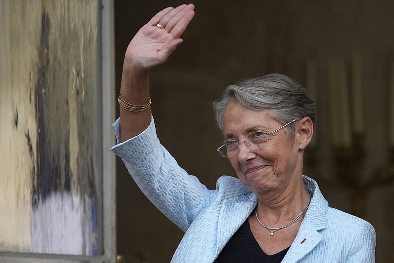 Newly named French Prime Minister Elisabeth Borne applauds former Prime minister Jean Castex after the handover ceremony Monday, May 16, 2022 in Paris. Centrist politician Elisabeth Borne was appointed France's new prime minister to become the second woman to hold the post in the country. As labor minister since 2020, Elisabeth Borne implemented changes that made it harder for jobless people to get benefits and reduced monthly payments for some unemployed people, prompting criticism from workers unions and from the left. (AP Photo/Christophe Ena)