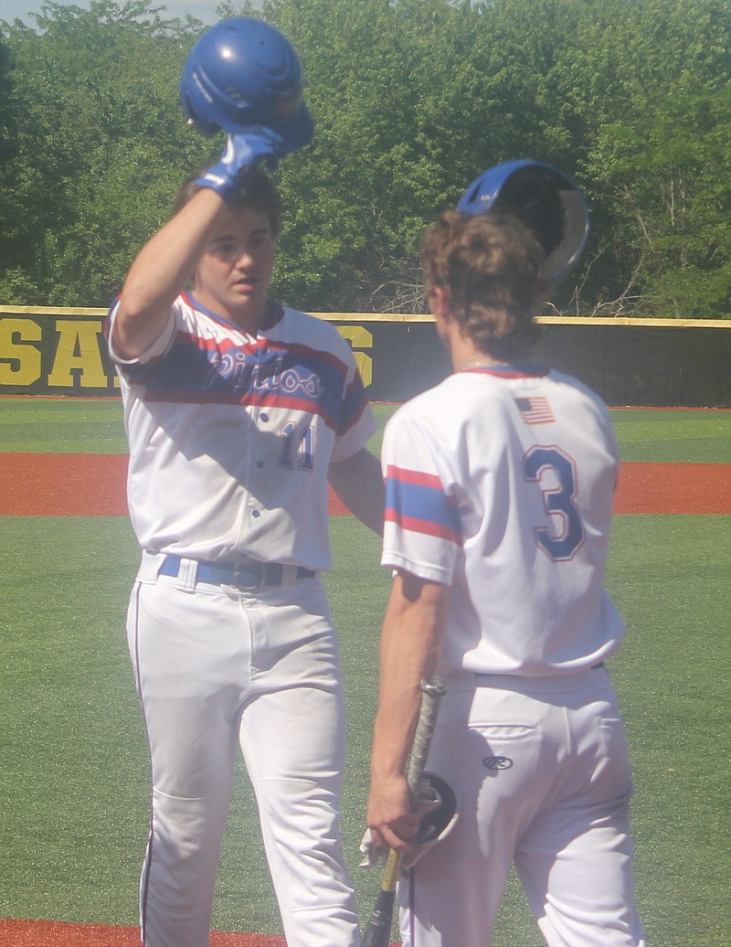 Senior Trevor Myers (left) hits a two-run home run to give the Pintos a 3-0 lead in the first inning against Buffalo.
