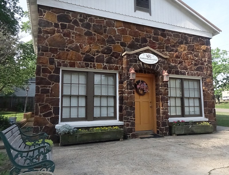 The quaint rock house which belongs now to the Linden Garden Club was once a service station. (Photo by Neil Abeles)
