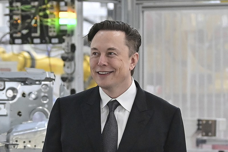 FILE - Tesla CEO Elon Musk attends the opening of the Tesla factory Berlin Brandenburg in Gruenheide, Germany on March 22, 2022. Musk says his deal to buy Twitter can&#x2019;t &#x2018;move forward&#x2019; unless the company shows public proof that less than 5% of the accounts on the platform are fake or spam. Musk made the comment in a reply to another user on Twitter early Tuesday, May 17, 2022. (Patrick Pleul/Pool Photo via AP, File)