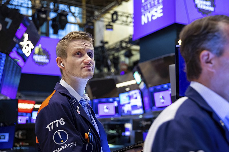 In this photo provided by the New York Stock Exchange, trader Colby Nelson works on the floor, Tuesday, May 17, 2022. Stocks rose in afternoon trading on Wall Street Tuesday as investors review an encouraging report on retail sales and a mixed batch of earnings updates from several big retailers. (Courtney Crow/New York Stock Exchange via AP)