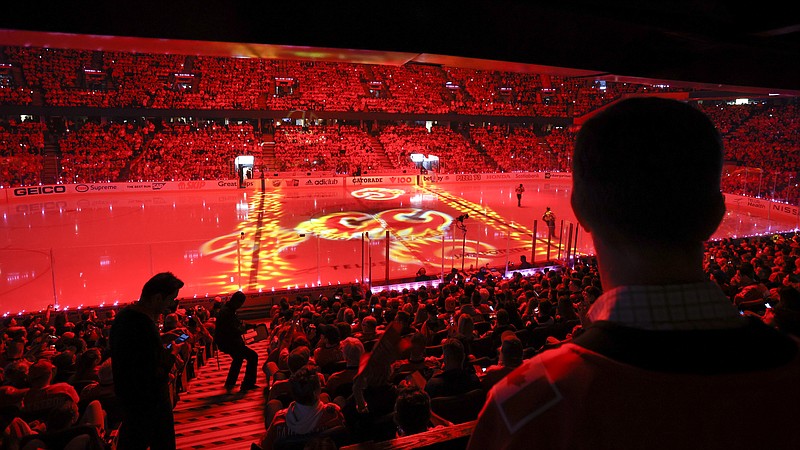 Calgary Flames fans wait for Game 1 of the team's NHL hockey first-round playoff series against the Dallas Stars on Tuesday, May 3, 2022, in Calgary, Alberta. (Jeff McIntosh/The Canadian Press via AP)