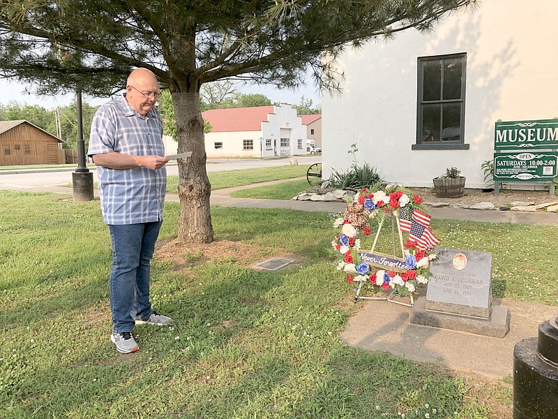 RACHEL DICKERSON/MCDONALD COUNTY PRESS Pineville Mayor Gregg Sweeten reads remarks after a wreath was placed at the David A. Thurman memorial on Tuesday during the board of aldermen meeting.