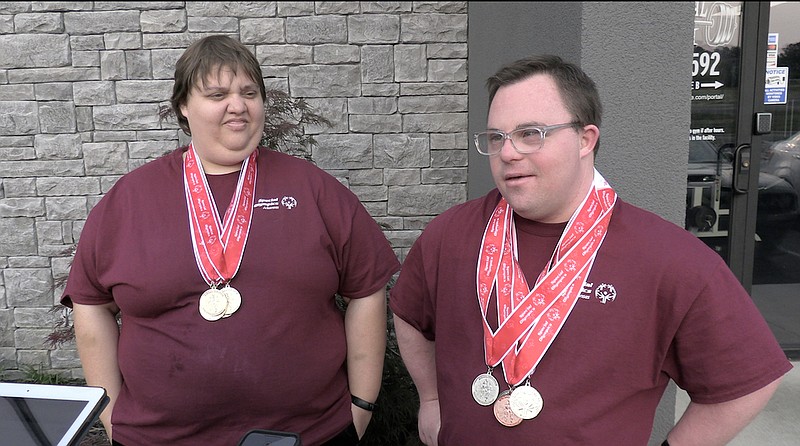 Special Olympics powerlifters Karly Pritchard, left, and Devin McClard explain their favorite parts of competing at Special Olympics competitions. - Photo by Donald Cross of The Sentinel-Record