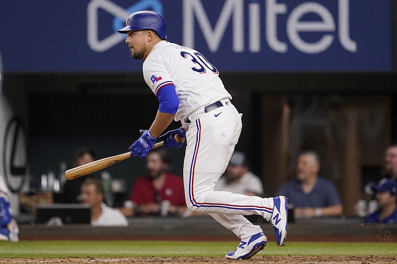 Texas Rangers' Nathaniel Lowe heads to first hitting an RBI single against the Los Angeles Angels during the eighth inning of a baseball game Tuesday, May 17, 2022, in Arlington, Texas. (AP Photo/Tony Gutierrez)