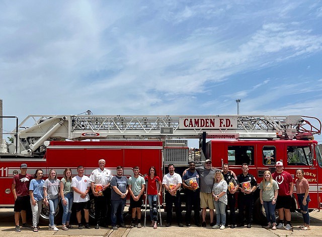 Submitted photo
Camden Fairview Beta Club members Jason Wolfe, Kyndal Johnston, Brooklyn Kelley, Emma Tuberville, Bill Lewis, Charley Olds, Grant Jeffus, Kynlee Carmen, Bob Daugherty, Jill Daugherty, Abby Word, Landon Morgan, and Libby Johnston joined Jill and Bob Daughtery today in presenting seven rescue floatation devices to the Camden Fire Department in memory of CFHS Junior Cooper Daugherty.