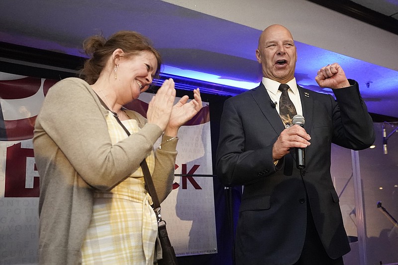 State Sen. Doug Mastriano, R-Franklin, a Republican candidate for Pennsylvania governor, gestures as he speaks at a primary night election gathering in Chambersburg, Pa., Tuesday, May 17, 2022, with his wife, Rebbeca. (AP Photo/Carolyn Kaster)