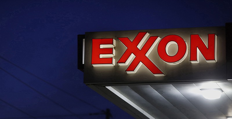 Exxon Mobil Corp. signage is displayed at a gas station in Richmond, Ky., on April 29, 2015. MUST CREDIT: Bloomberg photo by Luke Sharrett.