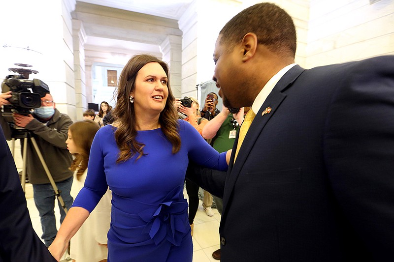 Republican gubernatorial candidate Sarah Huckabee Sanders (left) chats with with Democrat gubernatorial candidate Chris Jones (right) during the first day of candidate filing on Tuesday, Feb. 22, 2022, at the state Capitol in Little Rock. (Arkansas Democrat-Gazette/Thomas Metthe)