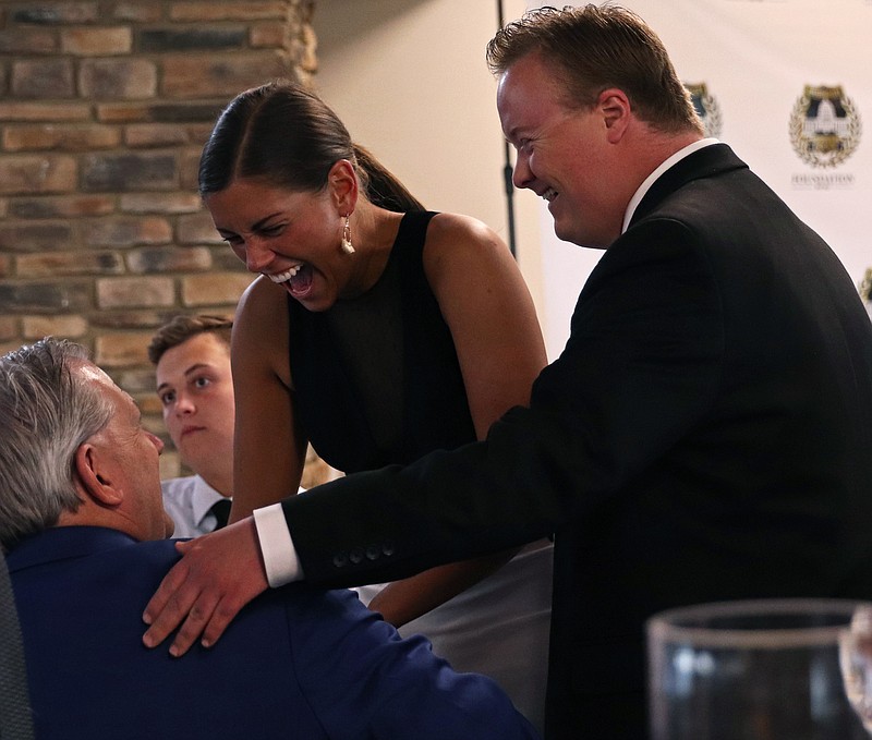 Kate Cassady/News Tribune
From left, Donnell Rehagen, Ashley Robbins and Elijah Mayfield talk Thursday during the Jefferson City Police Foundation Awards at Capital Bluffs Event Center. Robbins is Rehagen’s daughter, and a new police officer.