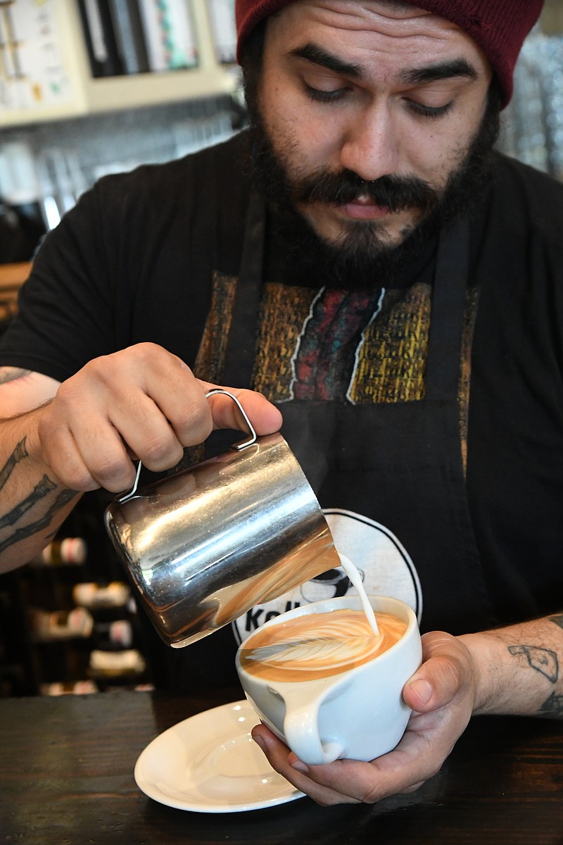 The Sentinel-Record/Tanner Newton /caption: Bryan Ramirez pours a cup of coffee at Kollective Coffee + Tea. HS Kollective-1 051922.JPG attached