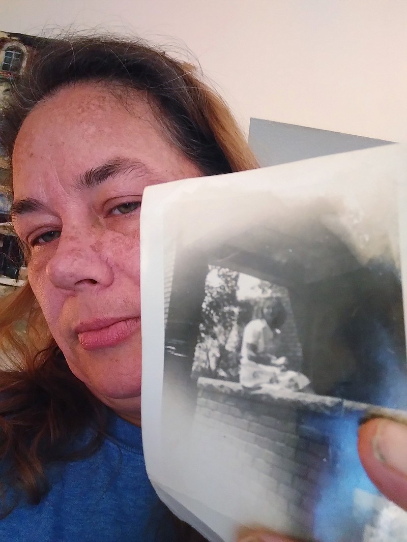 In this self portrait, Aprille Franco holds a photo of her grandmother, Fern Franco, when Fern Franco was young in this photo taken Tuesday, May 17, 2022. A prosecutor earlier this month charged Jennifer Anne Hall, with first-degree murder in Fern Franco's death. She was 75 when she died in 2002 while a patient at Hedrick Medical Center in Chillicothe, Missouri, where Hall worked as a respiratory therapist. Authorities say eight other suspicious deaths occurred around the same time as Franco's. (Aprille Franco via AP)