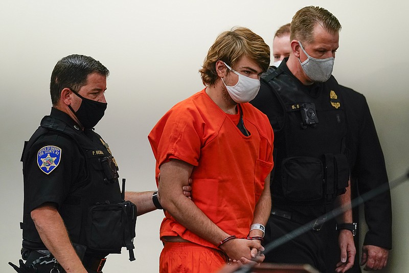 Payton Gendron is led into the courtroom for a hearing at Erie County Court, in Buffalo, N.Y., Thursday, May 19, 2022. Gendron faces charges in the May 14  fatal shooting at a supermarket. (AP Photo/Matt Rourke)