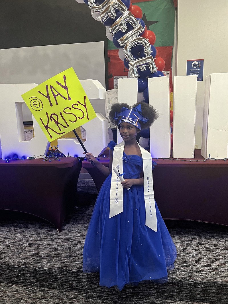 Kristalyn Dunn holds her celebration sign during the Head Start transitional celebration. (Special to the Commercial)