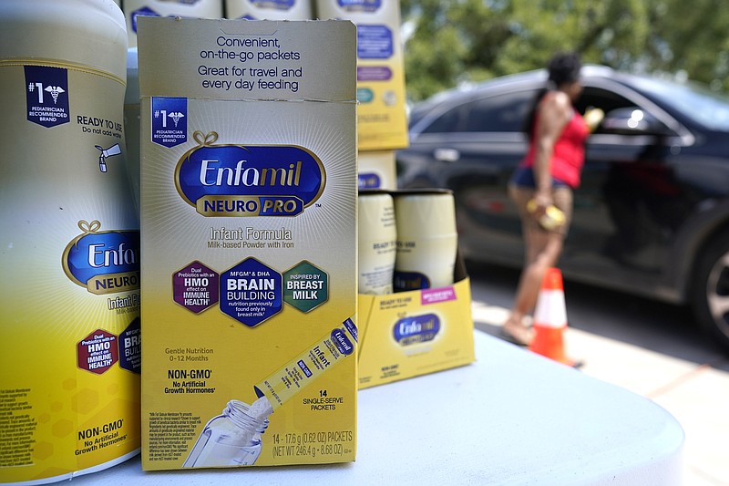 Katherine Gibson-Haynes helps distribute infant formula during a baby formula drive Saturday, May 14, 2022, in Houston. Parents seeking baby formula are running into bare supermarket and pharmacy shelves in part because of ongoing supply disruptions and a recent safety recall. (AP Photo/David J. Phillip)