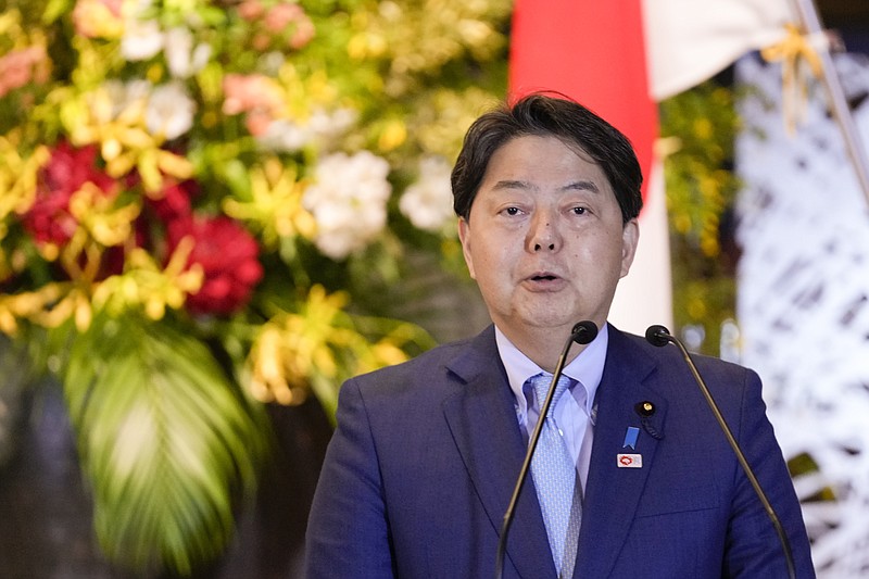 Japanese Foreign Minister Yoshimasa Hayashi speaks as Director-General of the International Atomic Energy Agency (IAEA) Rafael Grossi listens during a news conference at the Iikura guesthouse in Tokyo, Thursday, May 19, 2022. (AP Photo/Hiro Komae)