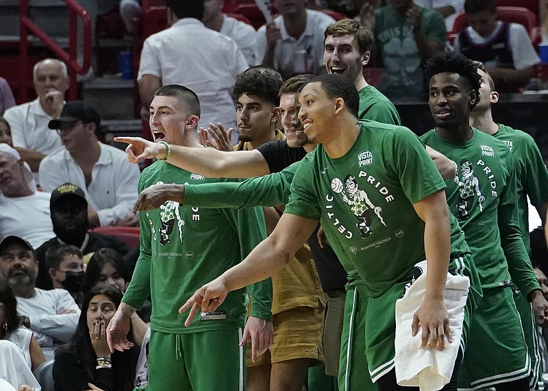 Boston Celtics players cheer the team from the bench during the second half of Game 2 of the NBA Eastern Conference finals playoff series against the Miami Heat Thursday in Miami. - Photo by Lynne Sladky of The Associated Press