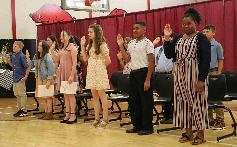 A group of North Heights Community School fifth-graders take their pledge Tuesday, May 17, 2022, during induction into the school's chapter of the National Elementary Honor Society program. (Photo courtesy of Dena Youngblood/TASD)