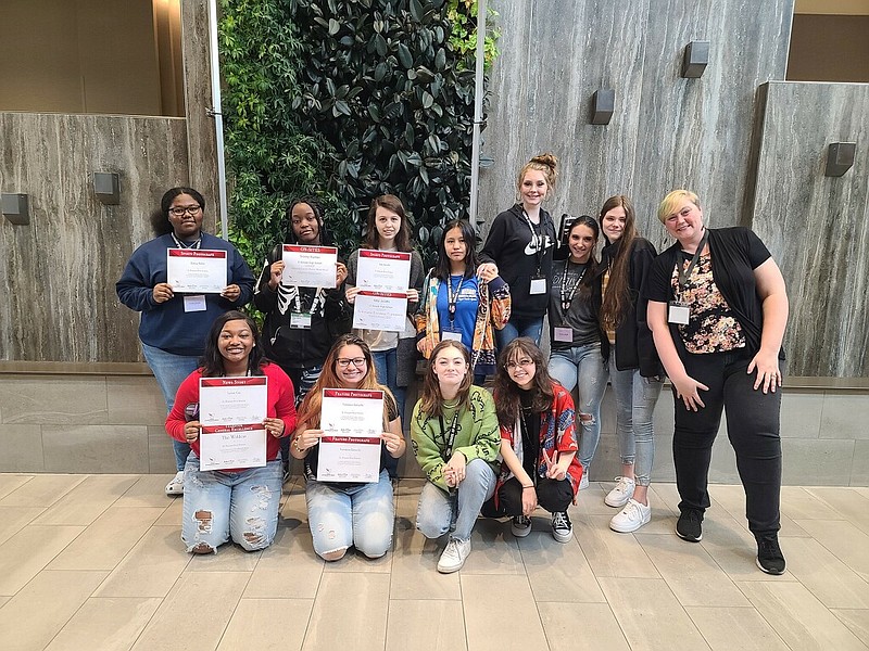 Pictured at the Arkansas Scholastic Press Association's 2022 convention in Jonesboro are, in the back row, from left to right, Ramya Miller, Trinity Hunter, Amy Jacobs, Yadira Garcia, Ansley Ball, Layla Maza and Brinkley Kilcrease; and in the front row, from left to right, Whitney Jones, Veronica Zartuche, Georgia Blackmon and Armenia Vartanian. EHS Journalism teacher Lauren Cross is pictured at right. (Contributed)