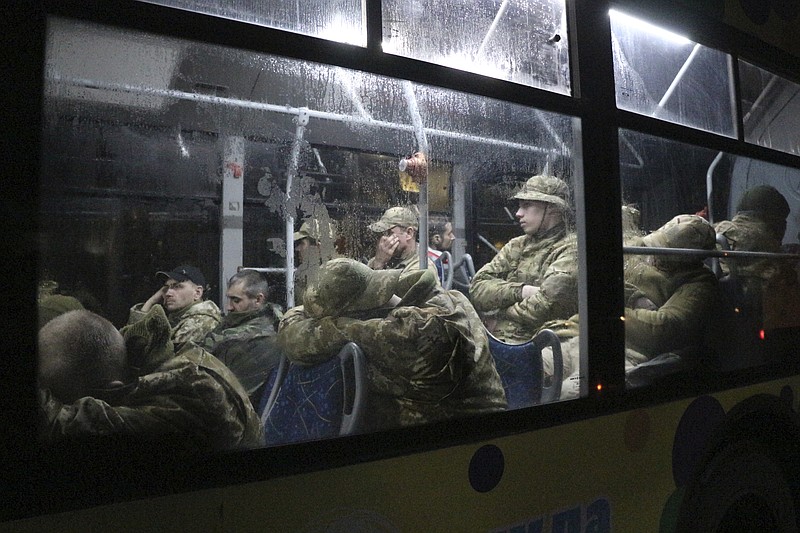 The Associated Press
Ukrainian servicemen sit in a bus after leaving Mariupol's besieged Azovstal steel plant, near a penal colony, in Olyonivka, in territory under the government of the Donetsk People's Republic, eastern Ukraine, on Friday.