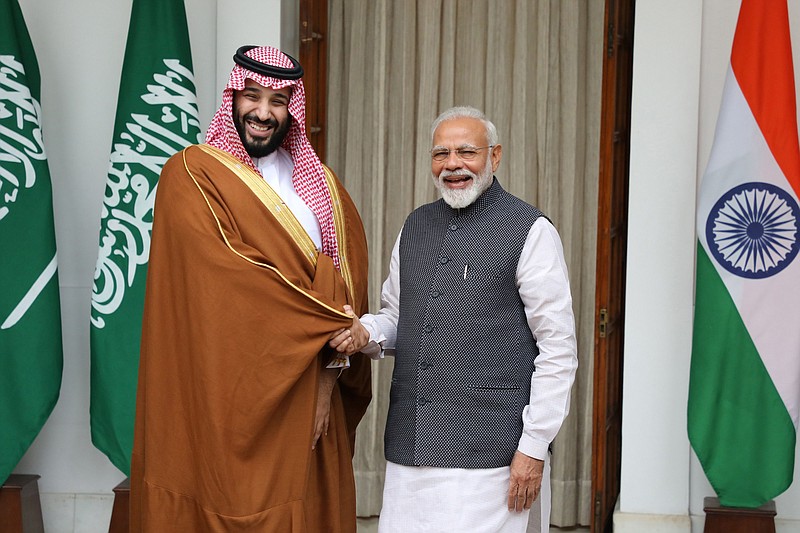 Mohammed Bin Salman, Saudi Arabia's crown prince, left, shakes hands with Narendra Modi, India's prime minister, at Hyderabad House in New Delhi on Feb. 20, 2019. MUST CREDIT: Bloomberg photo by T. Narayan.