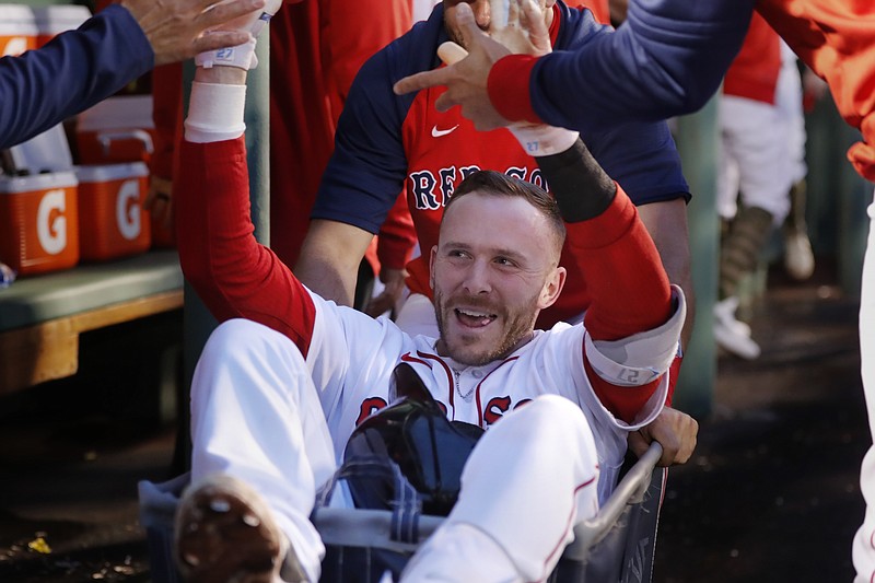 Boston Red Sox's Trevor Story celebrates his grand slam against the Seattle Mariners during the third inning of a baseball game Friday, May 20, 2022, in Boston. (AP Photo/Michael Dwyer)