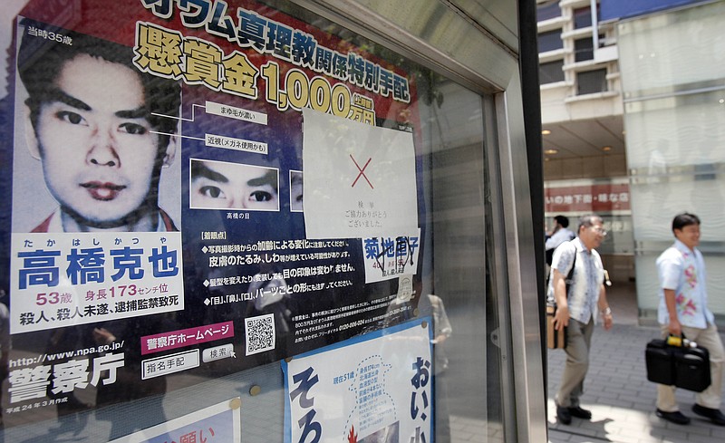 In this June 7, 2012 photo, a "wanted" poster of former Aum Shinrikyo cult member Katsuya Takahashi is displayed outside a police station in Tokyo. The United States is poised to remove five extremist groups, all believed to be defunct, from its list of foreign terrorist organizations. Several of these groups once posed significant threats, killing hundreds if not thousands of people across Asia, Europe and the Middle East. The organizations include the Basque separatist group ETA , the Japanese cult Aum Shinrikyo, the radical Jewish group Kahane Kach and two Islamic groups that have been active in Israel, the Palestinian territories and Egypt. (AP Photo/Koji Sasahara)