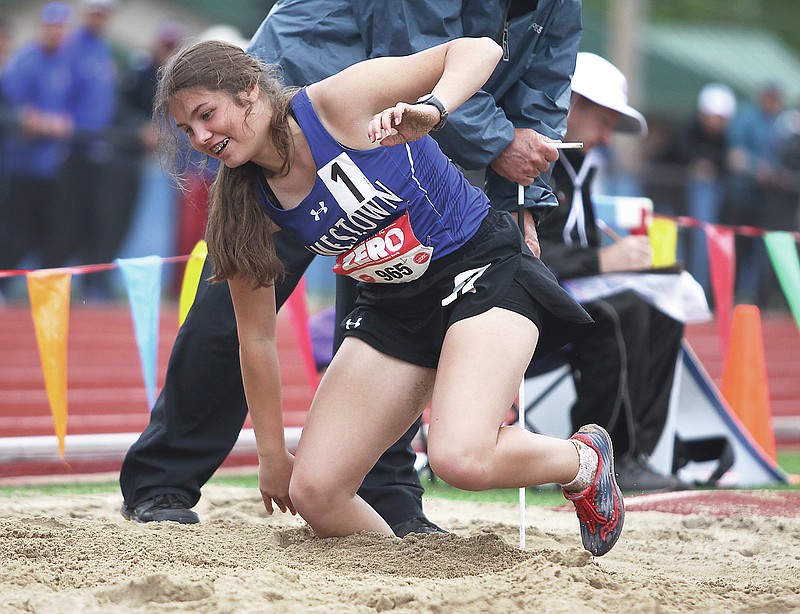Jamestown's Emma Baepler picks herself up from the sand after one of her attempts Saturday during the girls long jump in the Class 1 track and field state championships at Adkins Stadium. (Greg Jackson/News Tribune)