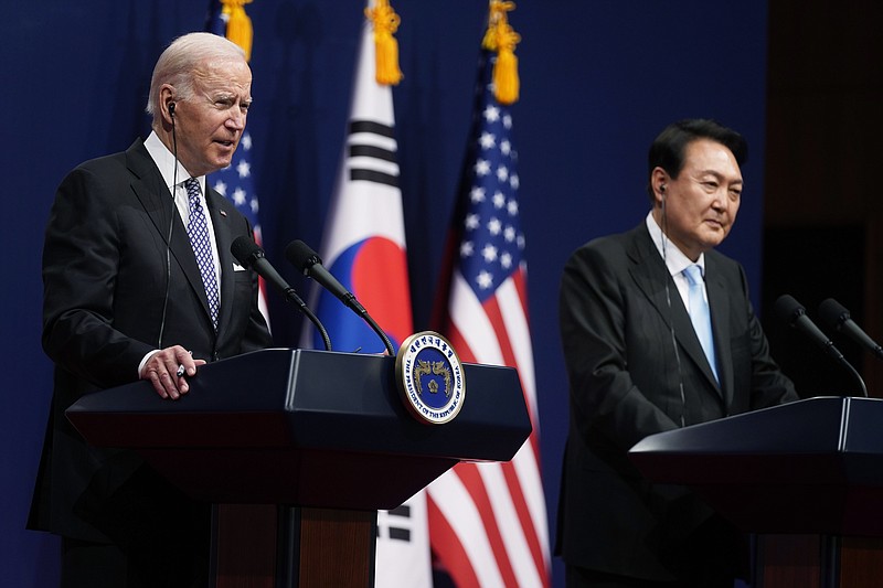 U.S. President Joe Biden, left, speaks as South Korean President Yoon Suk Yeol listens during a news conference at the People's House inside the Ministry of National Defense, Saturday, May 21, 2022, in Seoul, South Korea. (AP Photo/Evan Vucci)