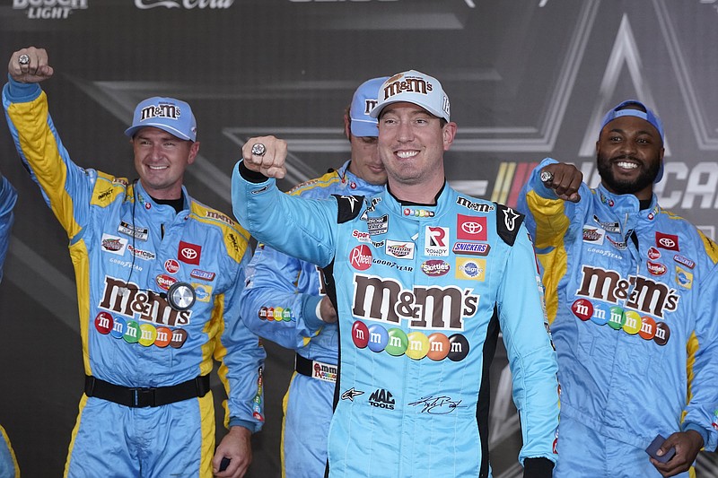 Kyle Busch, front, and his crew show off their pole position rings after qualifications for the NASCAR All-Star auto race at Texas Motor Speedway in Fort Worth, Texas, Saturday, May 21, 2022.(AP Photo/Larry Papke)