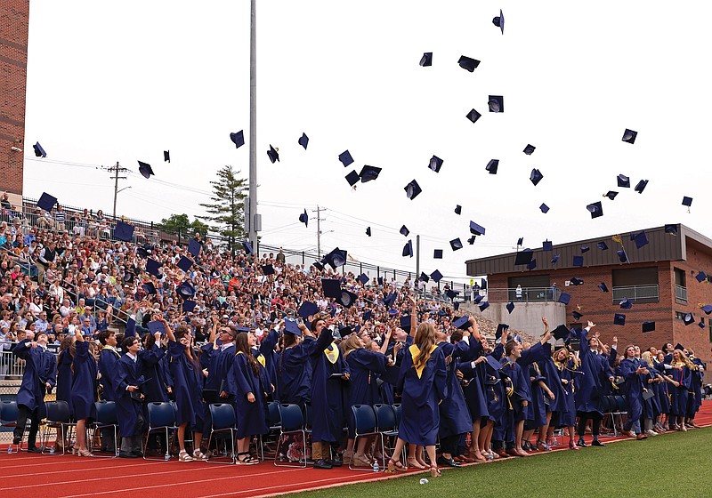 The Helias Catholic High School class of 2022 tosses their caps Sunday, May 22, 2022, during the graduation ceremony at Ray Hentges Stadium. (Kate Cassady/News Tribune photo)