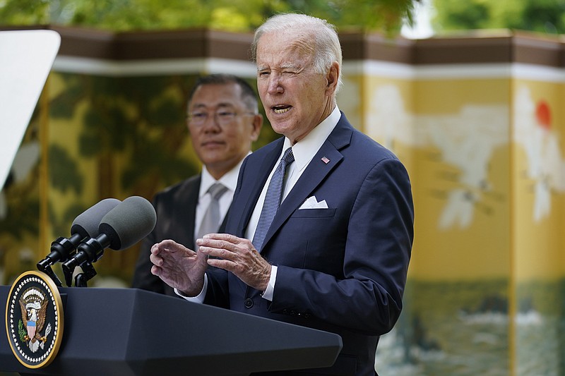 U.S. President Joe Biden, center, speaks during an event with Hyundai Motor Group Executive Chair Euisun Chung, rear, at the Grand Hyatt Seoul, Sunday, May 22, 2022, in Seoul. (AP Photo/Evan Vucci)