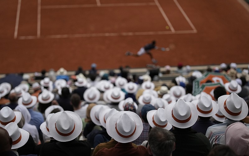 Spectators watch first round matches at the French Open tennis tournament in Roland Garros stadium in Paris, France, Sunday. - Photo by Christophe Ena of The Associated Press