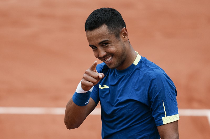 Bolivia's Hugo Dellien celebrates defeating Austria's Dominic Thiem in three sets, 6-3, 6-2, 6-4, in their first round match at the French Open tennis tournament in Roland Garros stadium in Paris, France, Sunday. - Photo by Thibault Camus of The Associated Press