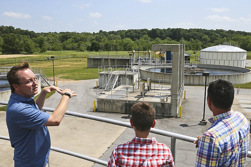 Plant Manager Mike Neil (from left) gives a tour as Nolan Burress and Tontitown Alderman Tim Burress look on, Thursday May 19, 2022 at the Northwest Arkansas Conservation Authority wastewater treatment plant in Bentonville. The Northwest Arkansas Conservation Authority is planning for an expansion of its wastewater treatment plant. Officials heard and discussed plans about the expansion. Check out nwaonline.com/220520Daily/ and nwadg.com/photos for a photo gallery.

(NWA Democrat-Gazette/Charlie Kaijo)