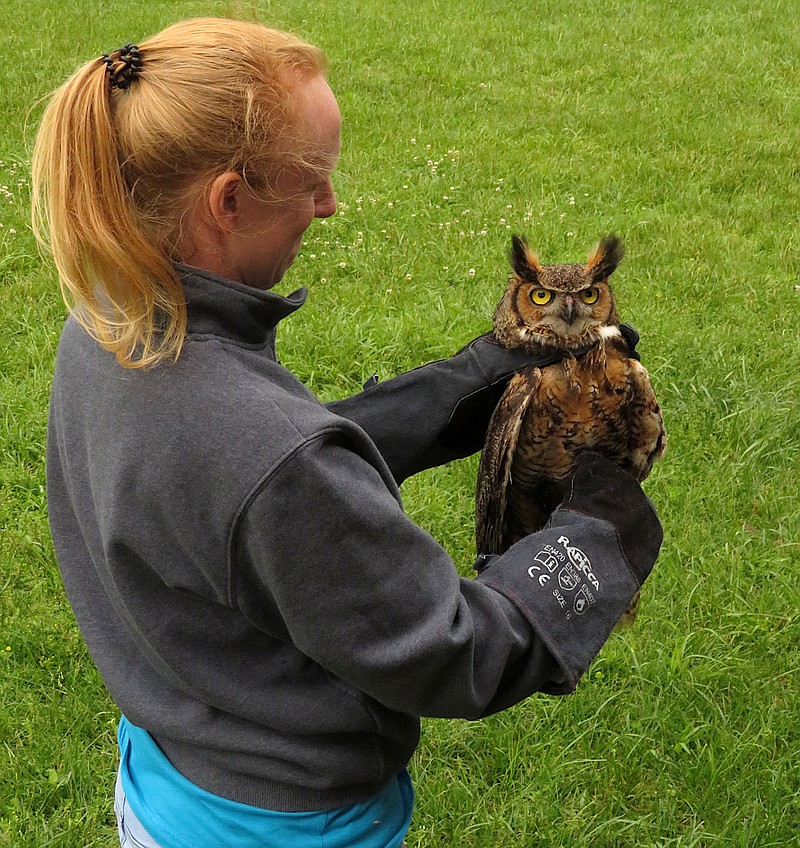 Westside Eagle Observer/RANDY MOLL
Emily Henrichs Warman, DVM, shows a great horned owl before its release on Sunday afternoon at Eagle Watch Nature Trail in Gentry. The owl was treated for flukes and released back into the wild by Northsong Wild Bird Rehabilitation.