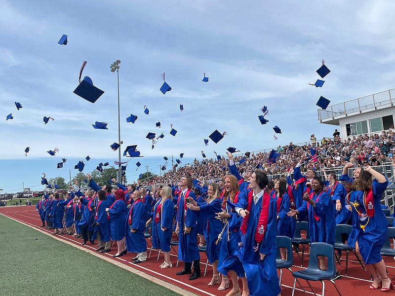 California High School seniors joyously throw their caps up into the air to signify the end of high school during their graduation ceremony on May 22, 2022. (Democrat photo/Kaden Quinn)
